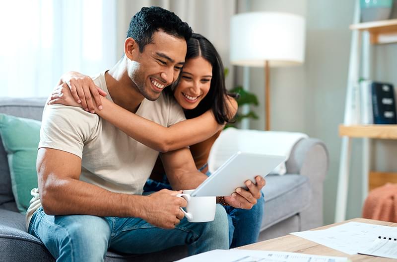 Smiling woman looking at laptop